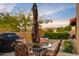 Outdoor patio with seating, grill, and mountain views at 25836 N Primo Cir, Rio Verde, AZ 85263