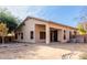 Home's backyard with covered patio and landscaping at 2625 N 110Th Dr, Avondale, AZ 85392
