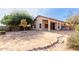 Spacious backyard with covered patio and rock pathway at 2625 N 110Th Dr, Avondale, AZ 85392