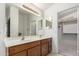 Double vanity bathroom with a large closet at 2625 N 110Th Dr, Avondale, AZ 85392
