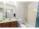 Clean bathroom with shower/tub combo and wood vanity at 2625 N 110Th Dr, Avondale, AZ 85392
