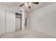 Bedroom with double door closet and plush carpeting at 2625 N 110Th Dr, Avondale, AZ 85392