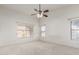 Spacious bedroom with ceiling fan and large windows at 2625 N 110Th Dr, Avondale, AZ 85392
