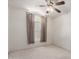 Bright bedroom with ceiling fan and window coverings at 2625 N 110Th Dr, Avondale, AZ 85392