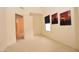 Neutral bedroom featuring modern artwork, a window with blinds, and plush carpeting at 2625 N 110Th Dr, Avondale, AZ 85392