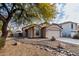 House exterior with a two-car garage and rock landscaping at 2625 N 110Th Dr, Avondale, AZ 85392