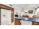 Kitchen boasts a large refrigerator and dishwasher at 2625 N 110Th Dr, Avondale, AZ 85392