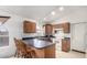 Kitchen features a breakfast bar and modern appliances at 2625 N 110Th Dr, Avondale, AZ 85392