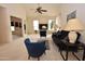 Bright and airy living room with vaulted ceilings, neutral carpet, and a comfortable seating arrangement at 2625 N 110Th Dr, Avondale, AZ 85392
