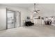 Spacious living room with vaulted ceiling and sliding glass doors at 2625 N 110Th Dr, Avondale, AZ 85392