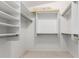 Large walk-in closet with shelving and hanging rods at 2625 N 110Th Dr, Avondale, AZ 85392