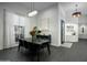 Modern dining room with marble table, black chairs, and stylish lighting at 27448 N 75Th Way, Scottsdale, AZ 85266