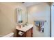 Clean bathroom with vanity, medicine cabinet, and shower at 3203 N Sycamore Pl, Chandler, AZ 85224