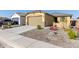 New single-story home with a two-car garage and desert landscaping at 3244 W Cedar Ridge Rd, Phoenix, AZ 85083