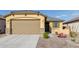 New single-story home with a two-car garage and desert landscaping at 3244 W Cedar Ridge Rd, Phoenix, AZ 85083