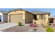 New single-story home with a two-car garage and desert landscaping at 3244 W Cedar Ridge Rd, Phoenix, AZ 85083