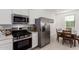 Modern kitchen featuring stainless steel appliances and breakfast nook at 3244 W Cedar Ridge Rd, Phoenix, AZ 85083