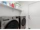 Laundry room with washer, dryer, and shelving at 3244 W Cedar Ridge Rd, Phoenix, AZ 85083