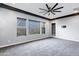 Well-lit bedroom with multiple windows and door at 3532 E Penedes Dr, Gilbert, AZ 85298