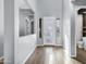 Modern entryway with grey walls and wood-look tile flooring at 3532 E Penedes Dr, Gilbert, AZ 85298