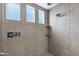 Clean shower with multiple shower heads and tile surround at 3532 E Penedes Dr, Gilbert, AZ 85298