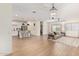 Open concept living area with kitchen, dining, and living spaces at 35321 W Santa Monica Ave, Maricopa, AZ 85138