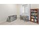 bedroom with bookcase, small table and chairs, and toy bin at 35321 W Santa Monica Ave, Maricopa, AZ 85138