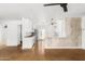 Modern white kitchen with stainless steel appliances and butcher block countertops at 3634 E Piccadilly Rd, Phoenix, AZ 85018