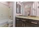 Clean bathroom with a vanity, shower, and toilet at 36549 N Porta Nuova Rd, Scottsdale, AZ 85262