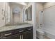 Bathroom with granite countertop and shower/tub combo at 36549 N Porta Nuova Rd, Scottsdale, AZ 85262