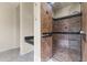 Large bathroom with walk-in shower, built-in seat, and granite vanity at 36549 N Porta Nuova Rd, Scottsdale, AZ 85262