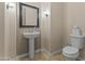 Clean bathroom with pedestal sink and toilet at 36549 N Porta Nuova Rd, Scottsdale, AZ 85262