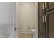Small bathroom with toilet and dark wood cabinets at 36549 N Porta Nuova Rd, Scottsdale, AZ 85262