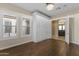 Bright bedroom featuring hardwood floors, abundant closet space, and access to a bathroom at 36549 N Porta Nuova Rd, Scottsdale, AZ 85262