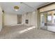 Primary bedroom with fireplace, access to patio, and elegant chandelier at 36549 N Porta Nuova Rd, Scottsdale, AZ 85262