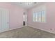 Spacious bedroom with carpet flooring, window shutters, and en-suite bathroom access at 36549 N Porta Nuova Rd, Scottsdale, AZ 85262
