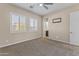 Bedroom with neutral wall and carpeted floor, and window shutters at 36549 N Porta Nuova Rd, Scottsdale, AZ 85262