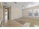 Spacious bedroom with large windows, plush carpeting, and built-in shelving at 36549 N Porta Nuova Rd, Scottsdale, AZ 85262