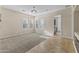 Large bonus room with tile and carpeted flooring and laundry access at 36549 N Porta Nuova Rd, Scottsdale, AZ 85262