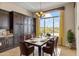 Bright breakfast nook with a view and a table for six at 36549 N Porta Nuova Rd, Scottsdale, AZ 85262
