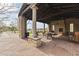Covered patio with fireplace; community space at 36549 N Porta Nuova Rd, Scottsdale, AZ 85262