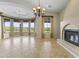 Sunlit dining room with a fireplace and large windows, showcasing beautiful views at 36549 N Porta Nuova Rd, Scottsdale, AZ 85262