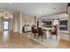 Elegant dining area with a large table and access to the kitchen at 36549 N Porta Nuova Rd, Scottsdale, AZ 85262