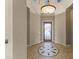 Elegant entryway featuring a circular tile design and a glass front door at 36549 N Porta Nuova Rd, Scottsdale, AZ 85262