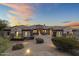 Stunning desert home with a tile roof, arched entryways, and desert landscaping at 36549 N Porta Nuova Rd, Scottsdale, AZ 85262