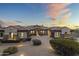 Beautiful home exterior at sunset with a three car garage at 36549 N Porta Nuova Rd, Scottsdale, AZ 85262