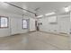 Spacious garage with overhead storage and window at 36549 N Porta Nuova Rd, Scottsdale, AZ 85262