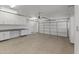 Garage with built-in cabinets and epoxy flooring at 36549 N Porta Nuova Rd, Scottsdale, AZ 85262