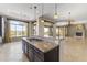 Gourmet kitchen with granite countertops and dark wood cabinets at 36549 N Porta Nuova Rd, Scottsdale, AZ 85262