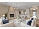 Spacious living room with a fireplace and comfortable seating at 36549 N Porta Nuova Rd, Scottsdale, AZ 85262